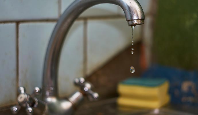 dripping water from tap in kitchen